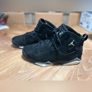 Black Nike Jordan High-Top Sneakers with Iconic Logo